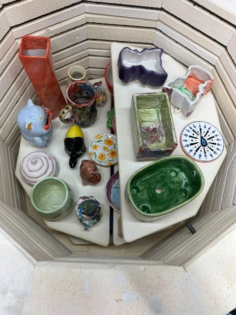 Finished glazed pieces in the kiln after firing